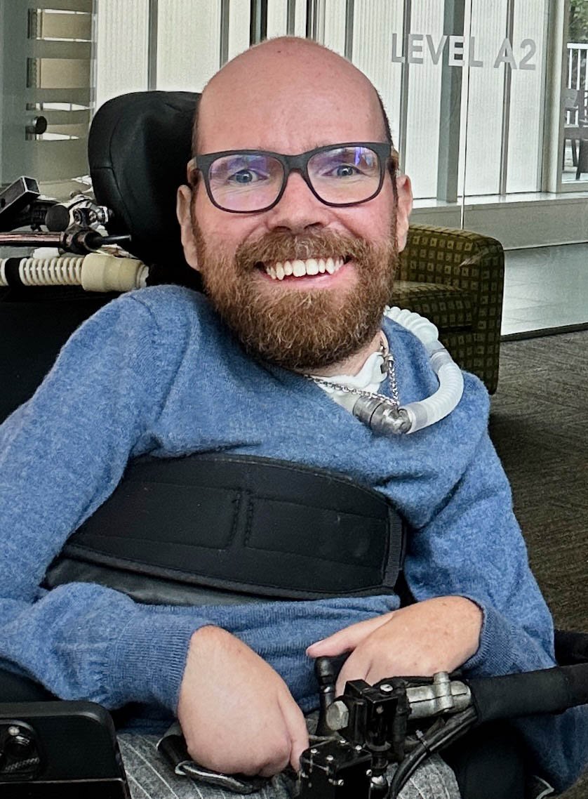 Amelia, a woman with a physical disability, smiling during her trip.